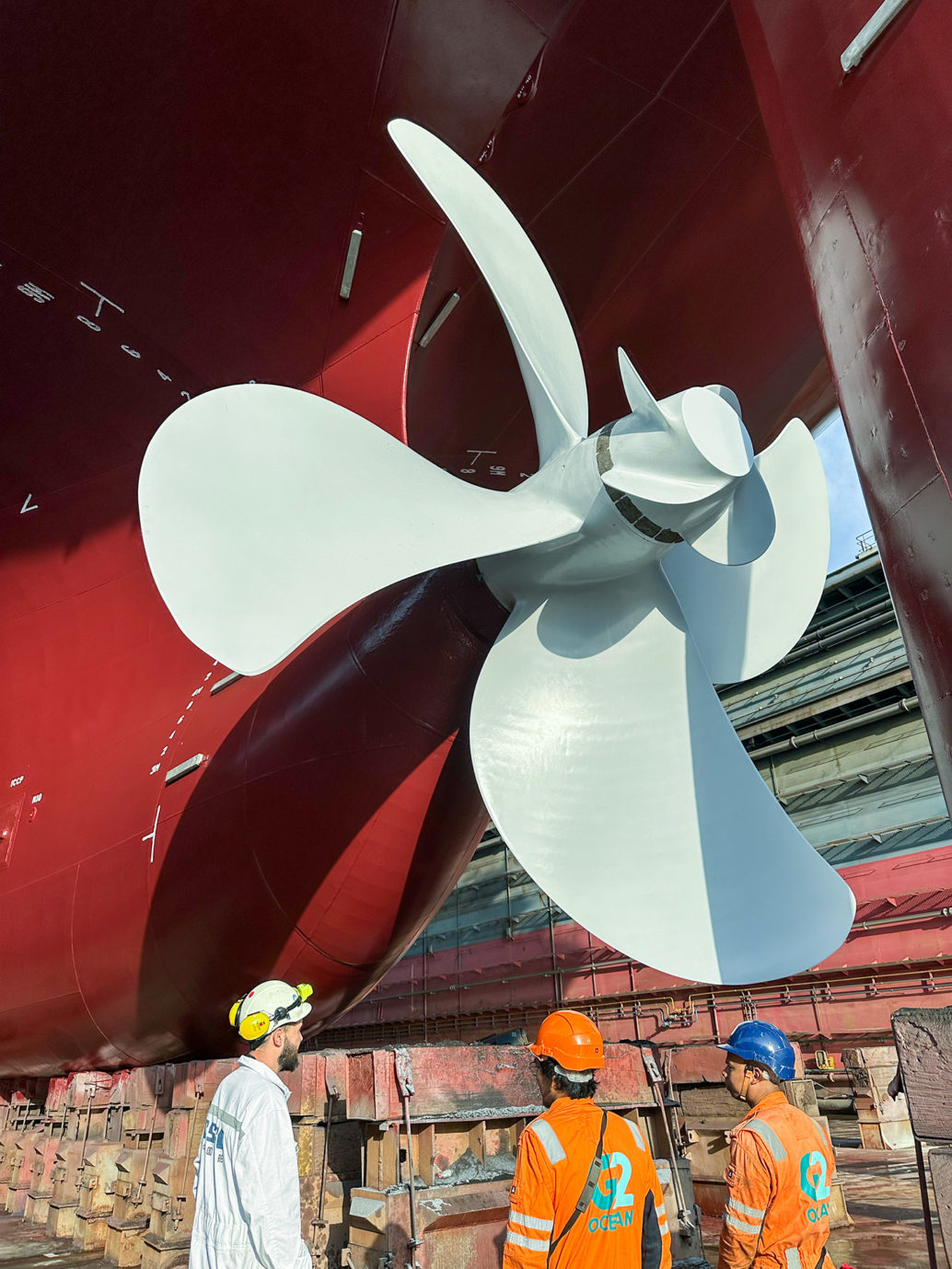 Engineers and seafarers by the propeller after applying graphene based coating on Star Lysefjord
